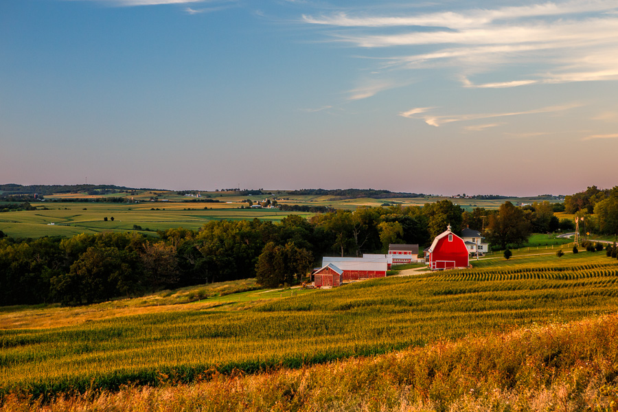 Red barn at sunset, rolling farmland
